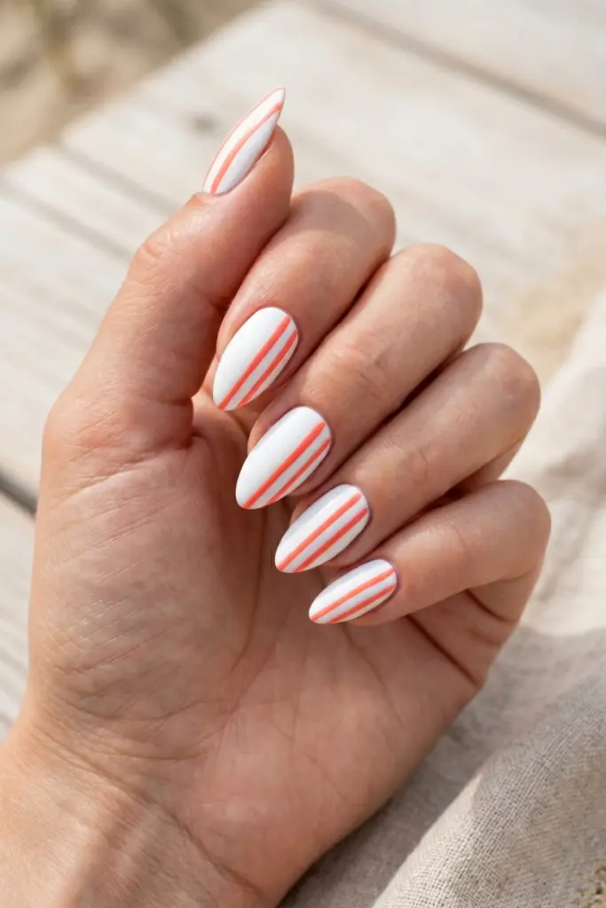 coral-diagonal-stripes-almond-nails