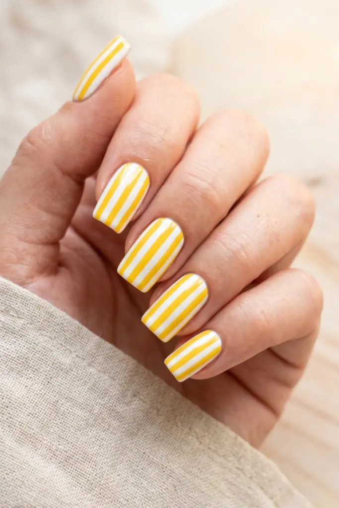 yellow-white-stripes-vertical-sunny-nails