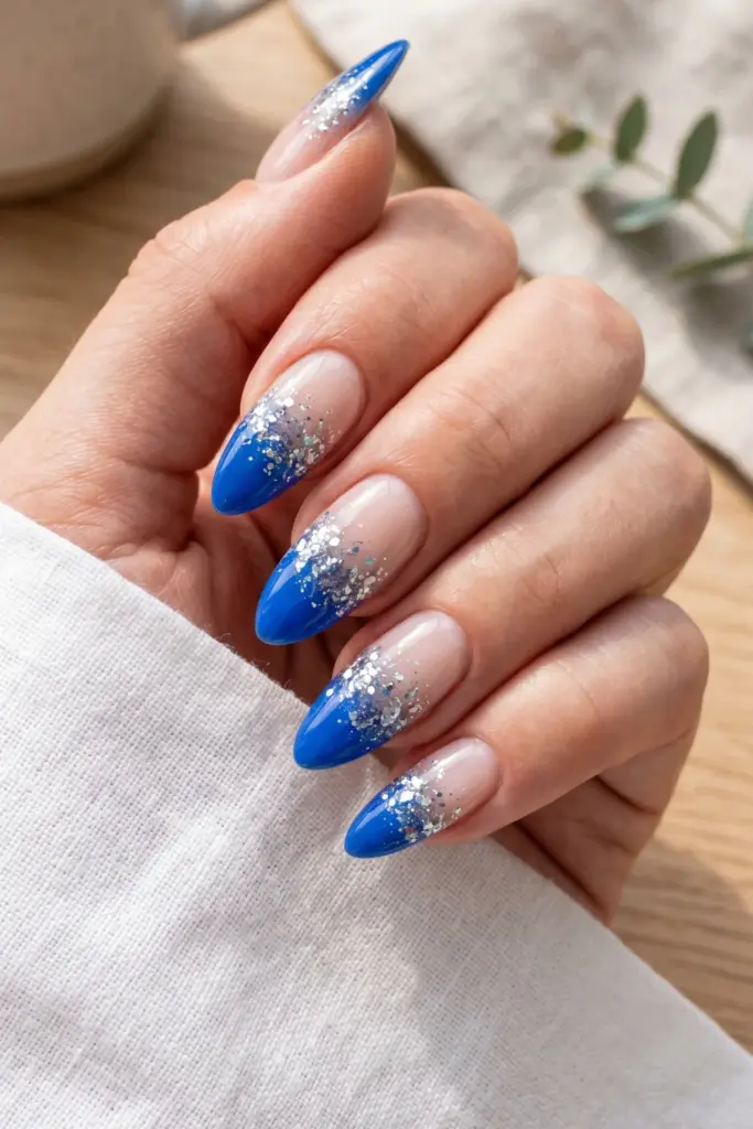 cobalt-blue-fade-glitter-accent-almond-summer-nails
