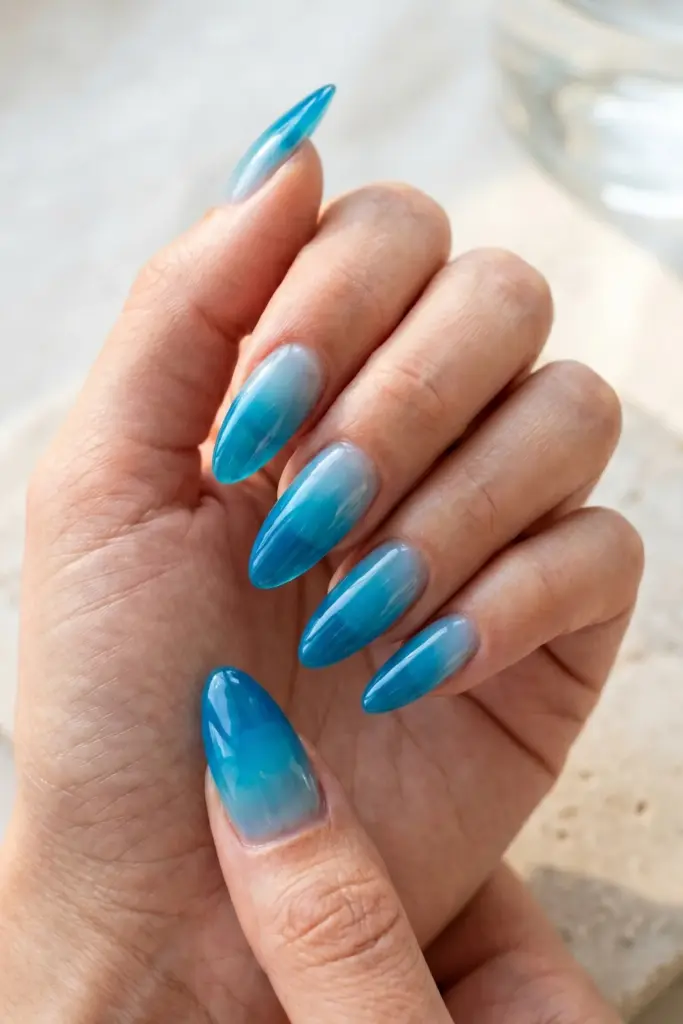 glossy-cerulean-translucent-blue-almond-ombre-summer-nails