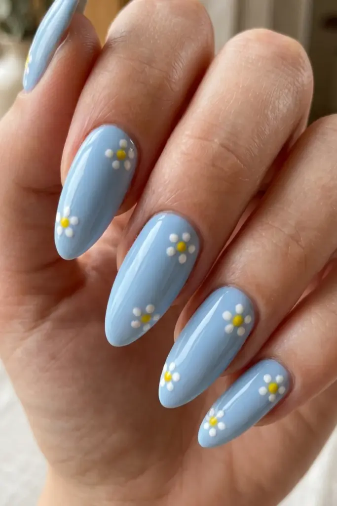 baby-blue-base-dotted-yellow-daisy-accents-girly-summer-nail-design-ideas