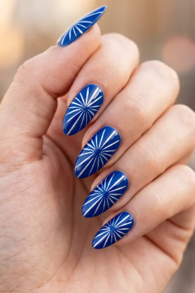 blue-base-with-silver-burst-lines-stunning-firework-nail-designs-fourth-july-holiday-parties