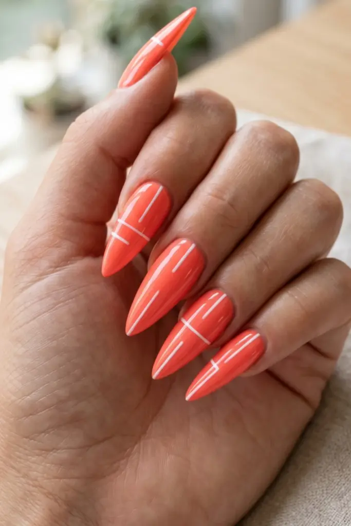 coral-neon-floating-lines-stiletto-acrylic-summer-nail-design-ideas