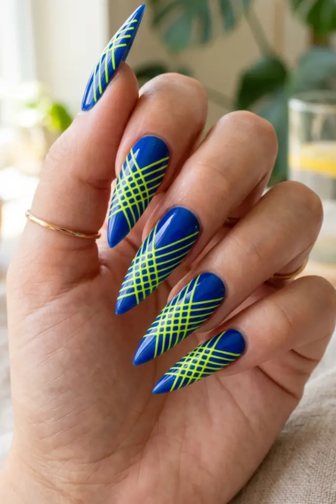 electric-blue-neon-yellow-crosshatch-stiletto-acrylic-summer-nail-design-ideas