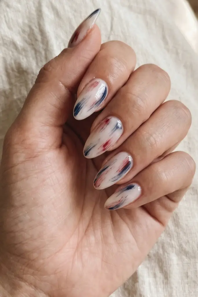 minimalist_patriotic_nails_abstract_red_blue_brushstroke_on_sheer