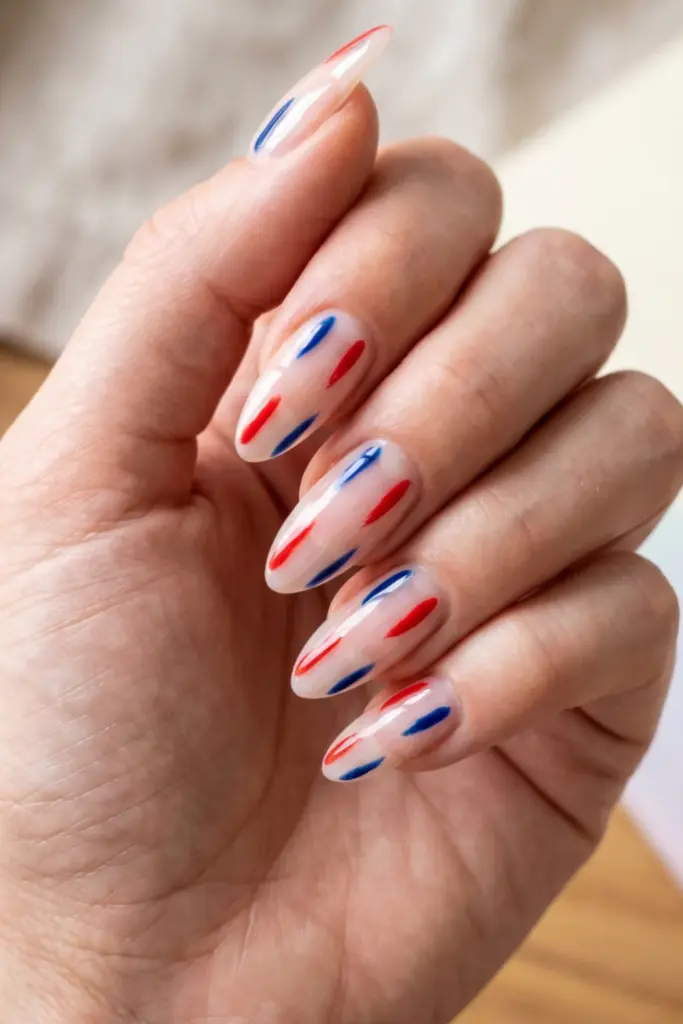 minimalist_patriotic_nails_clear_with_red_blue_diagonal_dashes