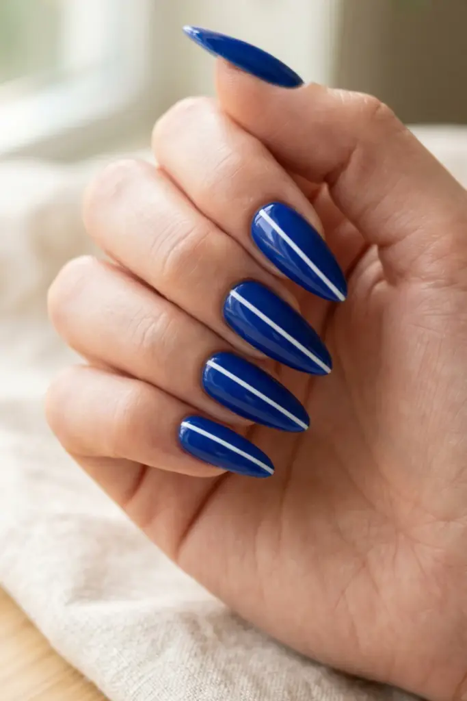 minimalist_patriotic_nails_cobalt_blue_base_single_white_line