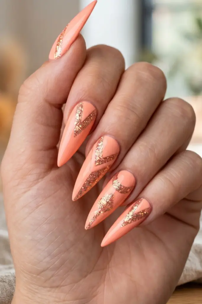 neon-peach-glitter-geometric-accents-stiletto-summer-nails