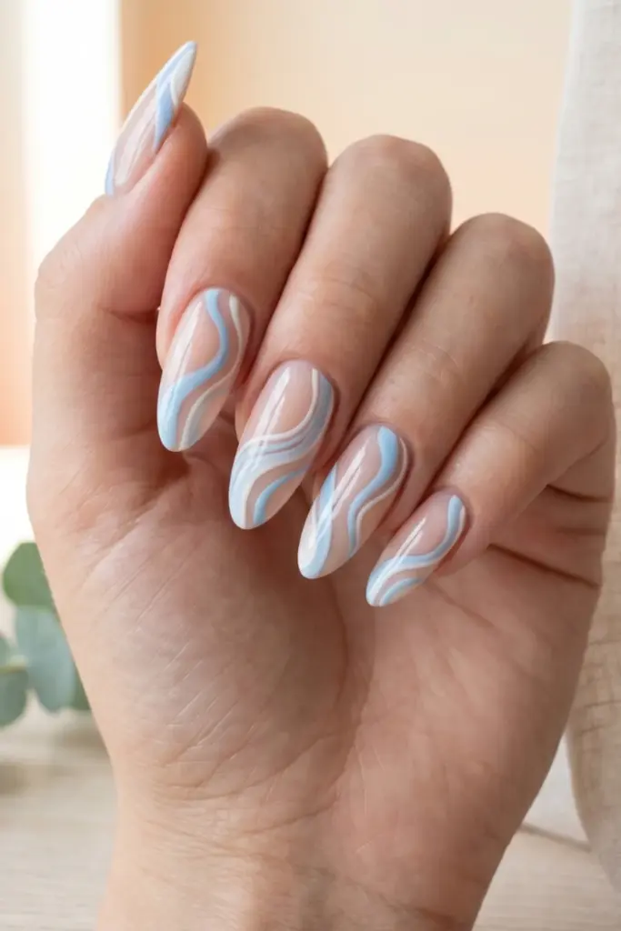 powder-blue-abstract-waves-pastel-summer-nail-design-ideas