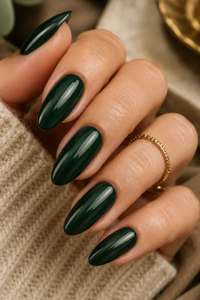 Elegant forest green glossy manicure with refined autumn nail styling in a classy Pinterest aesthetic.