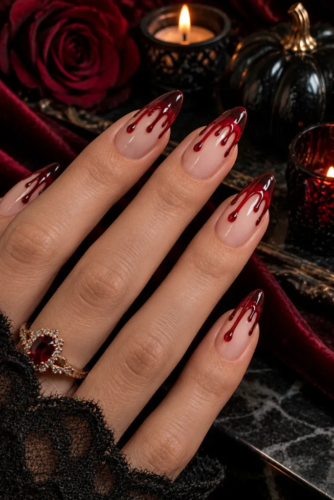 Elegant nude French tip Halloween nails with dramatic deep-red bloody drip details, designed in a trendy 2026 style.