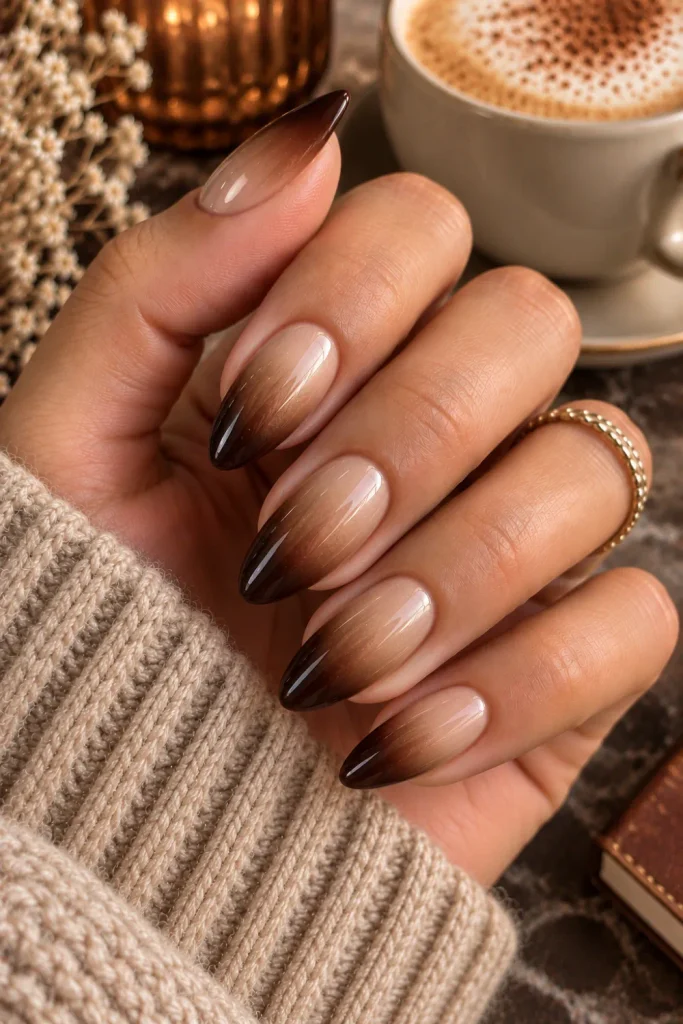 Espresso and creamy latte ombre nails with a smooth café-inspired gradient, a cozy polished winter autumn manicure in a modern 2026 style.